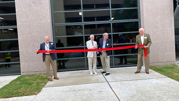 Novak at ribbon cutting ceremony for Capitol Complex Project Phase I Central Utility Plant, the first facility completed in the Capitol Complex Project. Also shown from left to right are John Raff, William Allensworth, and Keith Hall. 