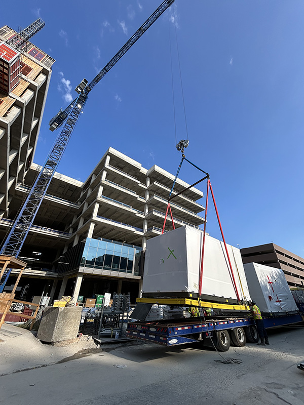 August 9, 2025 - 1501 Lavaca air handler units being flown to the appropriate floor.
