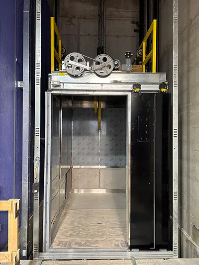 Installation of the cab in the South 1 elevator in the 1501 Lavaca State Office Building. (Photos courtesy of K&M Elevator, LLC)