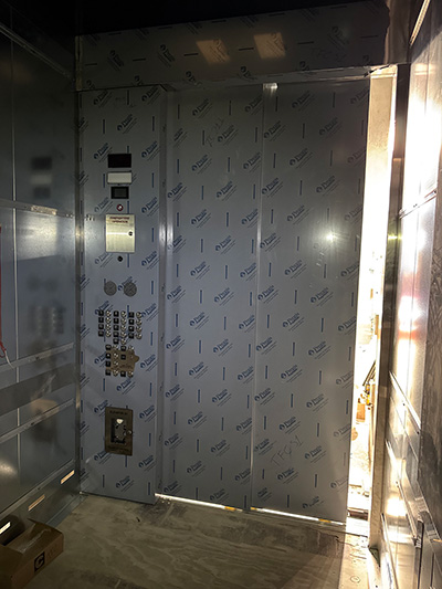 Installation of the cab in the South 1 elevator in the 1501 Lavaca State Office Building. (Photos courtesy of K&M Elevator, LLC)