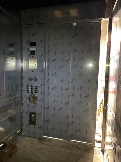 Installation of the cab in the South 1 elevator in the 1501 Lavaca State Office Building. (Photos courtesy of K&M Elevator, LLC)